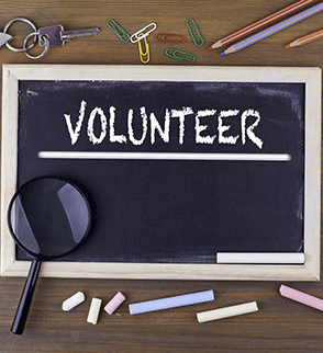 Volunteer On Chalkboard